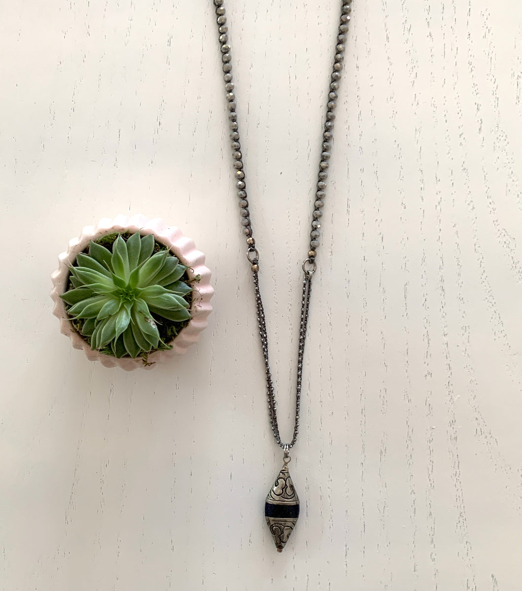 Hematite And Tibetan Charm Long Statement Necklace